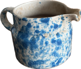 a short ceramic pitcher